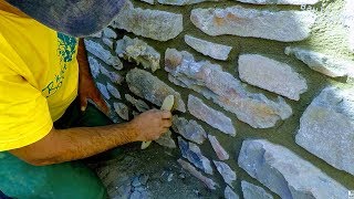 HOW TO BUILD NATURAL STONE WALL RETAINING ROCK BOULDERS DETAIL MASONRY ADVICE TUTORIAL CONSTRUCTION [upl. by Wilhelmina]