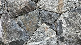 Secrets to creating a beautiful NATURAL STONE WALL Insights from a real stonemason [upl. by Alyag]